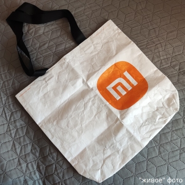 Эко-сумка Xiaomi Mi Eco Bag, модель: 33G10ZD2103H, материал Tyvek DuPont, высокая прочность на разрыв, высокая стойкость к многократным изгибам, водостойкость, химическая стойкость, термостойкость (сохраняет прочность и гибкость при – 75°, плавится при +135°), малый вес, стабильность размеров, застёжка-кнопка, две ручки, белая сумка с чёрными ручками и оранжевым логотипом или с серыми ручками и серым логотипом, фабричная упаковка, Киев